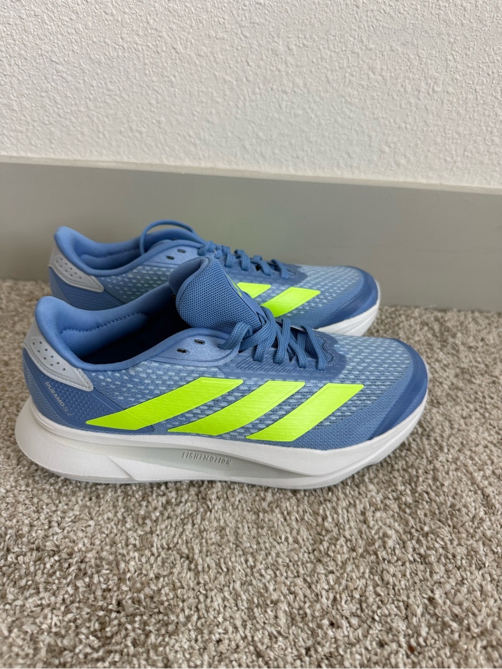 adidas Blue Athletic Sneakers with Neon Yellow Stripes